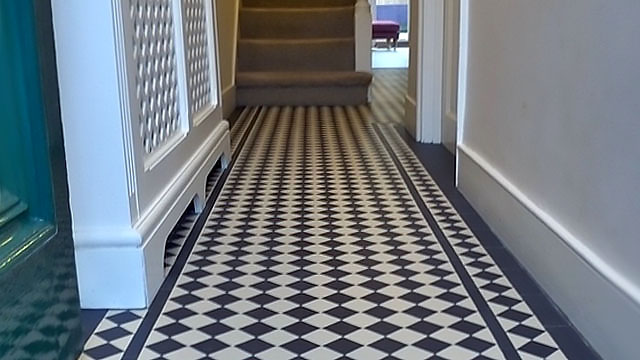 Traditional Victorian Hall Tiles with decorative radiator cover. Black and White hall tiles