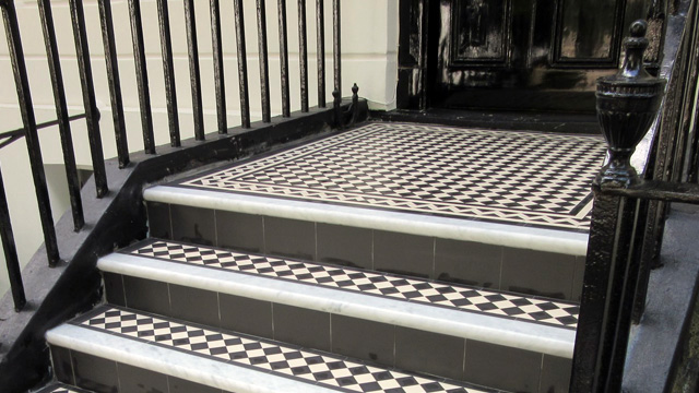 Victorian black and white step tiling with marble treads and iron railings alongside. Victorian Tiles for Town House Steps