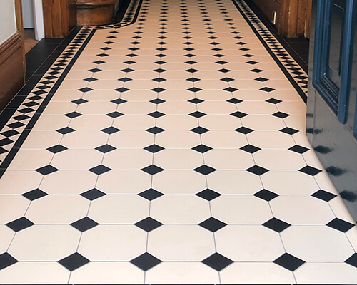 White and black, octagon and dot, hallway floor tiles.