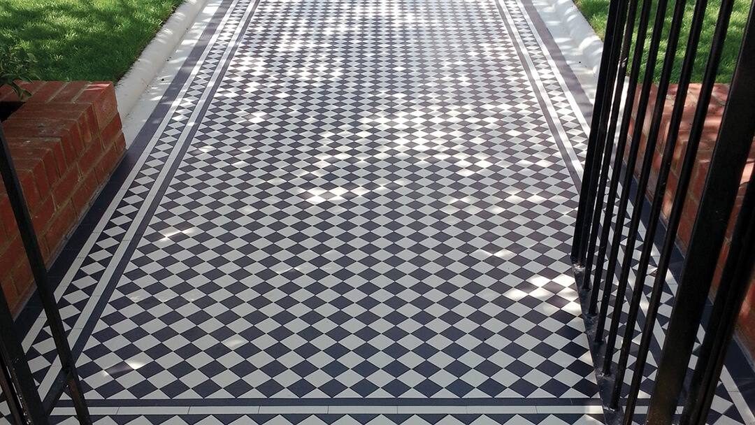 Black and White Victorian chequerboard path tiles.