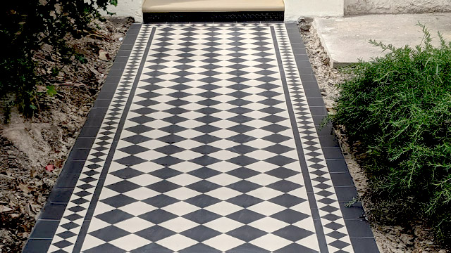 Larger format, 100mm black and white outdoor path tiles with 50mm Kingsley border.