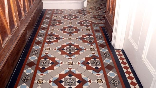 High Victorian era style hallway tiles featuring patterned encaustics.
