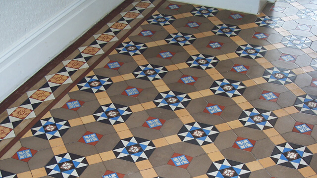 Restored and cleaned Victorian floor tiles. Minor repairs and cleaning to colourful period tiles.