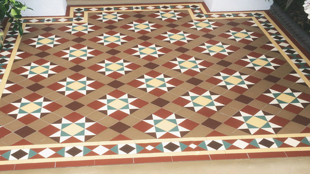 Edwardian mosaic path tiles in warm earthy colourway.