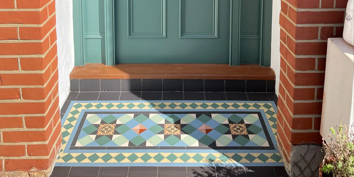 Victorian mosaic encaustic tiles on entrance porch step
