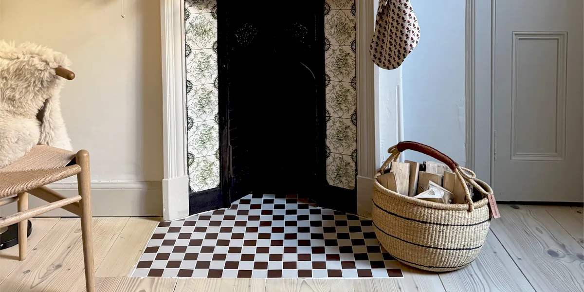 Brown and white chquerboard tiles fitted in fire hearth
