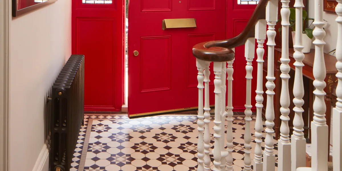 A traditional black and white Victorian mosaic hall floor design using octagons contrasted with a star motif