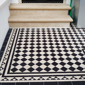 Black and white Victorian garden tiles - Traditional Yorkstone steps and a daisy grate for cellar ventilation