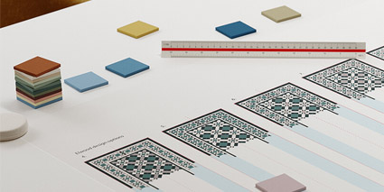 Tile design consultancy. Sample tiles, ruler and design options on office desk.