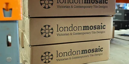 Stacked boxes of London Mosaic tiles.