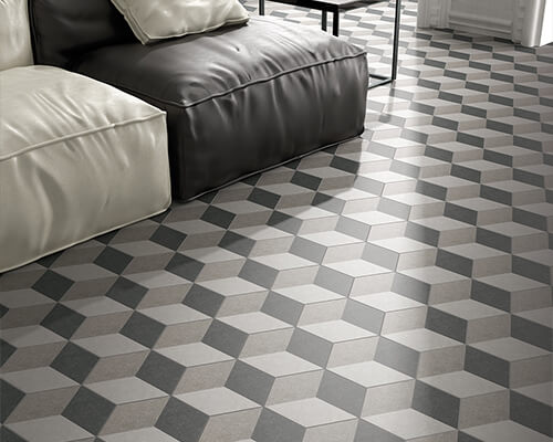 3D decor hexagon in tile in tones of grey on living room floor.