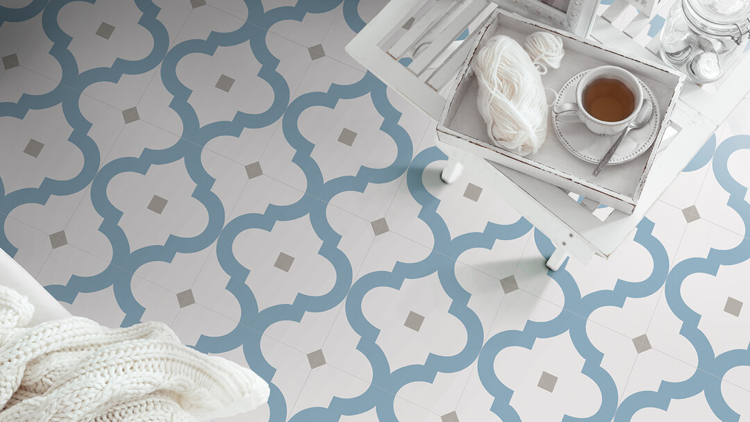 Blue and Grey porcelain tiles on conservatory floor with cup of tea.
