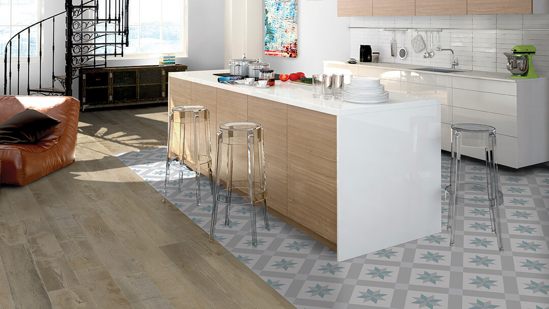 Modern kitchen with printed porcelain floor tiles in blues and greys.