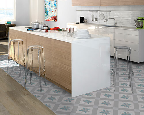 Modern kitchen with printed porcelain floor tiles in blues and greys.