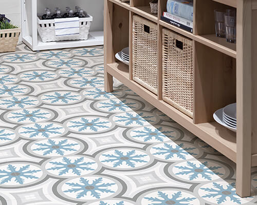 Printed large format porcelain tiles on pantry floor in tones of blue and grey.