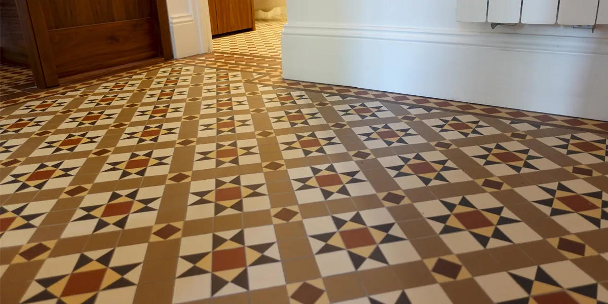 Warm toned Victorian mosaic tiles in entrance hallway