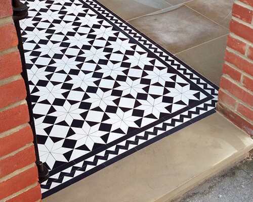 Traditional Victorian pattern combining custom cut diamond shape with standard geometric tiles.